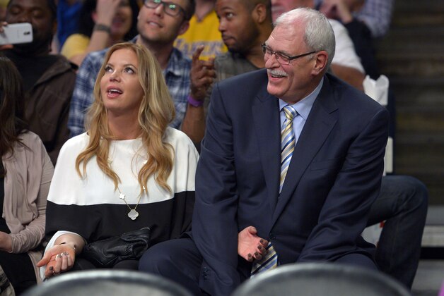 Jeanie Buss, left, Los Angeles Lakers executive vice president of business operations, and former Lakers head coach Phil Jackson sit during the first half of their NBA basketball game against the Dallas Mavericks, Tuesday, April 2, 2013, in Los Angeles. (AP Photo/Mark J. Terrill)
