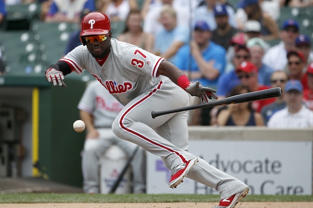 Philadelphia Phillies' Odubel Herrera bunts for a single during the first inning of a baseball game against the Chicago Cubs, Saturday, May 28, 2016, in Chicago. (AP Photo/Nam Y. Huh)