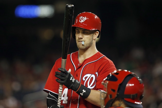 Washington Nationals right fielder Bryce Harper (34) prepares to bat with chewing gum hanging out of his mouth during a baseball game against the St. Louis Cardinals at Nationals Park, Saturday, May 28, 2016, in Washington. The Cardinals won 9-4. (AP Photo/Alex Brandon)