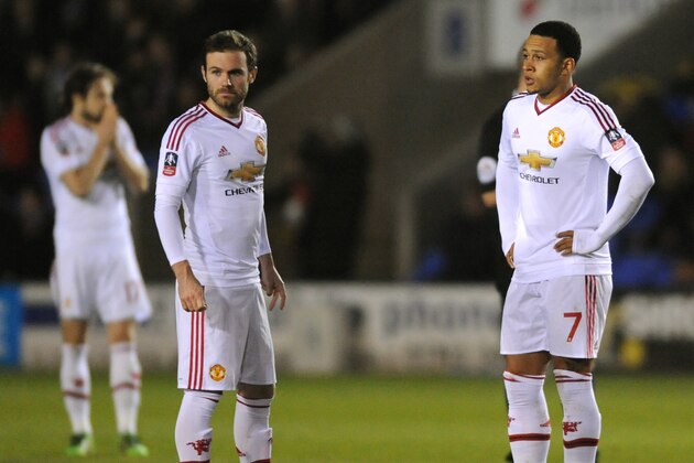 Manchester United’s Juan Mata, left, and Manchester United’s Memphis Depay during the English FA Cup fifth round soccer match between Shrewsbury Town and Manchester United at Greenhous Meadow stadium in Shrewsbury, England, Monday, Feb. 22, 2016. (AP Photo/Rui Vieira)