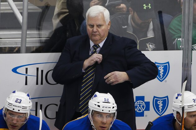 St. Louis Blues head coach Ken Hitchcock  stands behind his bench during an NHL hockey game against the Pittsburgh Penguins in Pittsburgh Wednesday, Nov. 25, 2015.(AP Photo/Gene J. Puskar)