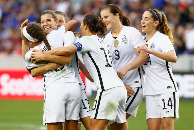 HOUSTON, TX - FEBRUARY 21:  Tobin Heath #17 of the United States gets mobbed by her teammates after Heath scored a second half goal against Canada during the Championship final of the 2016 CONCACAF Women's Olympic Qualifying at BBVA Compass Stadium on February 21, 2016 in Houston, Texas.  (Photo by Scott Halleran/Getty Images)