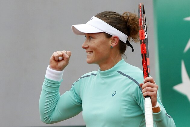Australia's Samantha Stosur reacts as she defats Romania's Simona Halep during their fourth round match of the French Open tennis tournament at the Roland Garros stadium, Tuesday, May 31, 2016 in Paris.  (AP Photo/Alastair Grant)