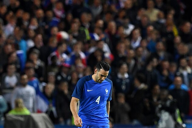 France's defender Adil Rami reacts after Cameroon scored during the friendly football match between France and Cameroon, at the Beaujoire Stadium in Nantes, western France, on May 30, 2016.   / AFP / FRANCK FIFE        (Photo credit should read FRANCK FIFE/AFP/Getty Images)