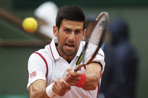 Serbia's Novak Djokovic returns the ball in the fourth round match of the French Open tennis tournament against Spain’s Roberto Bautista Agut at the Roland Garros stadium in Paris, France, Tuesday, May 31, 2016. (AP Photo/Michel Euler)