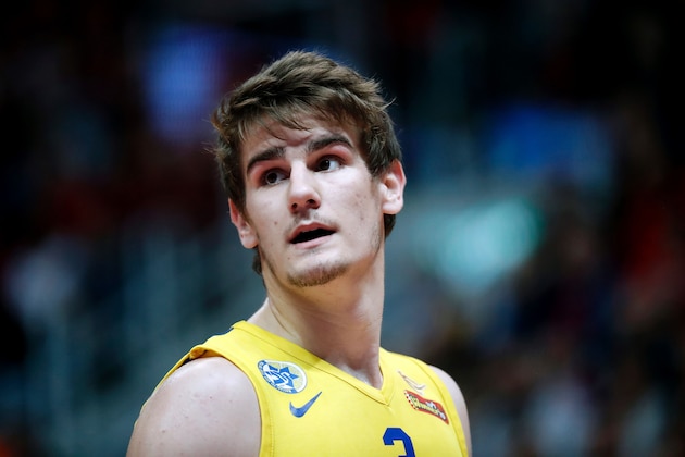Maccabi Tel Aviv's Croatian player Dragen Bender reacts during a Winner League match between Maccabi Tel Aviv and Hapoel Jerusalem at the Pais Arena in Jerusalem on March 21, 2016.

Dragan Bender's name is not yet well known beyond hardcore basketball fans, but that may soon change. Bender, currently playing for Israeli club Maccabi Tel Aviv, is expected to be highly sought after by US professional basketball teams in the coming months.
 / AFP / THOMAS COEX        (Photo credit should read THOMAS COEX/AFP/Getty Images)