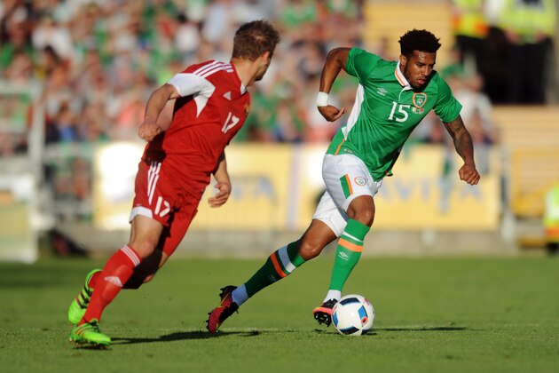 Republic of Ireland's defender Cyrus Christie (R) runs past Belarus's midfielder Maksim Valadzko (L) during the international friendly football match between Republic of Ireland and Belarus at Turner's Cross stadium in Cork, Ireland, on May 31, 2016. / AFP / CAROLINE QUINN        (Photo credit should read CAROLINE QUINN/AFP/Getty Images)