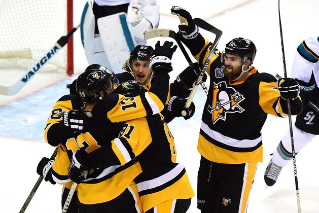 PITTSBURGH, PA - MAY 30:  Nick Bonino #13 of the Pittsburgh Penguins celebrates with teammates after scoring a third period goal against Martin Jones #31 of the San Jose Sharks in Game One of the 2016 NHL Stanley Cup Final at Consol Energy Center on May 30, 2016 in Pittsburgh, Pennsylvania.  (Photo by Matt Kincaid/Getty Images)