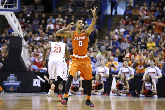 Syracuse's Michael Gbinije celebrates after hitting a 3-point shot during the first half in a first-round men's college basketball game in the NCAA tournament against Dayton, Friday, March 18, 2016, in St. Louis. (AP Photo/Jeff Roberson)