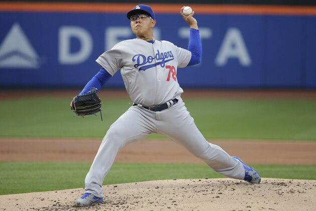 Los Angeles Dodgers' Julio Arias delivers a pitch during the first inning of a baseball game against the New York Mets Friday, May 27, 2016, in New York. (AP Photo/Frank Franklin II)