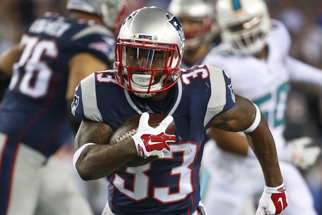 New England Patriots running back Dion Lewis runs the ball against the Miami Dolphins during a NFL football game at Gillette Stadium in Foxborough, Mass. Thursday, Oct. 29, 2015. (Winslow Townson/AP Images for Panini)