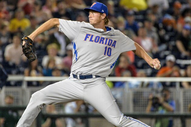 Florida starting pitcher A.J. Puk delivers against Virginia during the first inning of an NCAA College World Series baseball game in Omaha, Neb., Monday, June 15, 2015. (AP Photo/Ted Kirk)