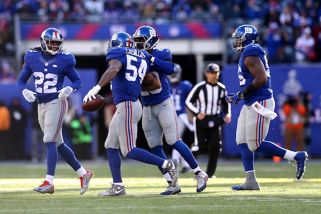 EAST RUTHERFORD, NJ - JANUARY 03:  Jonathan Casillas #54 of the New York Giants celebrates with his teammates after intercepting a ball thrown by Sam Bradford #7 of the Philadelphia Eagles during their game at MetLife Stadium on January 3, 2016 in East Rutherford, New Jersey.  (Photo by Elsa/Getty Images)
