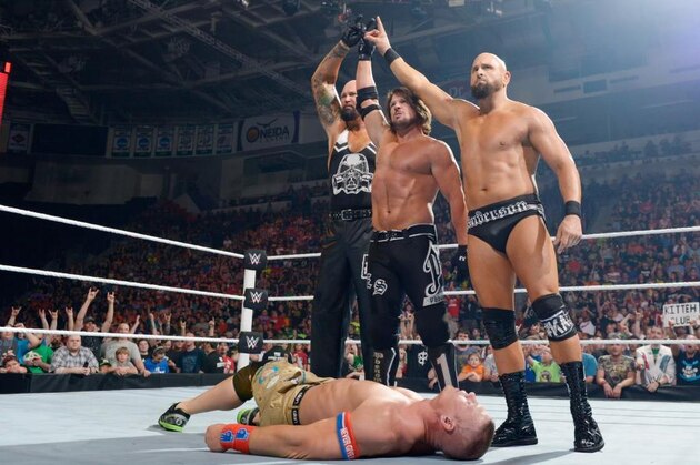 The Club reunite and stand tall over John Cena, admiring their handiwork. The Club reunite and stand tall over John Cena, admiring their handiwork.