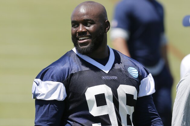 Dallas Cowboys defensive tackle Maliek Collins walks off the field while talking with teammates after a workout at the team's NFL football minicamp, Friday May 6, 2016, in Irving, Texas. (AP Photo/Tony Gutierrez)