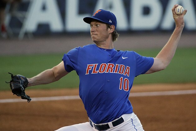 Florida pitcher A.J. Puk delivers against Arkansas during the third inning of a Southeastern Conference college baseball tournament game against Arkansas, Friday, May 22, 2015, in Hoover, Ala. (AP Photo/Brynn Anderson)