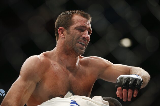 Luke Rockhold reacts after defeating Chris Weidman in a middleweight championship mixed martial arts bout at UFC 194, Saturday, Dec. 12, 2015, in Las Vegas. (AP Photo/John Locher)