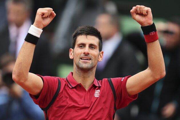 Serbia's Novak Djokovic celebrates winning his fourth round match of the French Open tennis tournament against Spain’s Roberto Bautista Agut at the Roland Garros stadium in Paris, France, Wednesday, June 1, 2016. (AP Photo/David Vincent)
