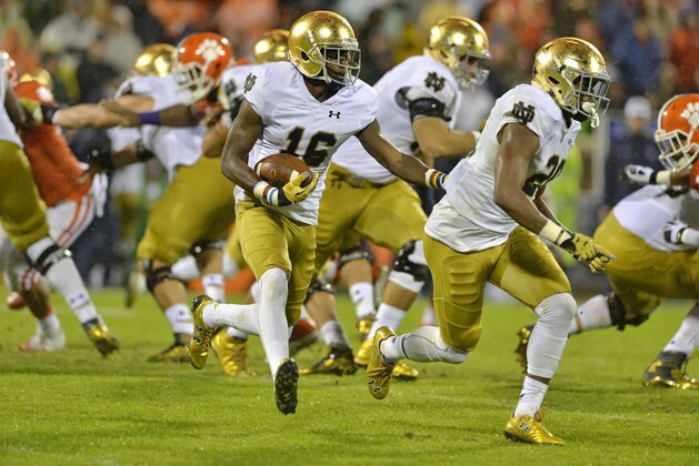 Notre Dame's Torii Hunter Jr. (16) with blocking help from C. J. Prosise, rushes out of the backfield during the first half of an NCAA college football game against Clemson Saturday, Oct. 3, 2015,  in Clemson,  S.C.  Clemson won 24-22. (AP Photo/Richard Shiro)