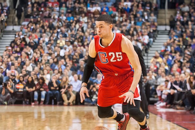Jan 24, 2016; Toronto, Ontario, CAN; Los Angeles Clippers guard Austin Rivers (25) dribbles down court against Toronto Raptors in the second quarter at Air Canada Centre. Raptors beat Clippers 112 - 94. Mandatory Credit: Peter Llewellyn-USA TODAY Sports