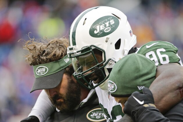 New York Jets defensive end Muhammad Wilkerson (96) is helped off the field after being hurt on a play during the second half of an NFL football game against the Buffalo Bills, Sunday, Jan. 3, 2016, in Orchard Park, N.Y. (AP Photo/Bill Wippert)