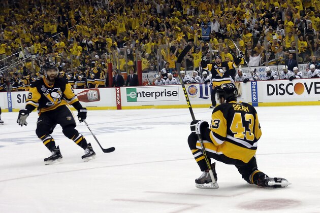Pittsburgh Penguins' Conor Sheary, right, celebrates his goal with Kris Letang, left, during the first period in Game 1 of the Stanley Cup final series against the San Jose Sharks Monday, May 30, 2016, in Pittsburgh.  (AP Photo/Keith Srakocic)