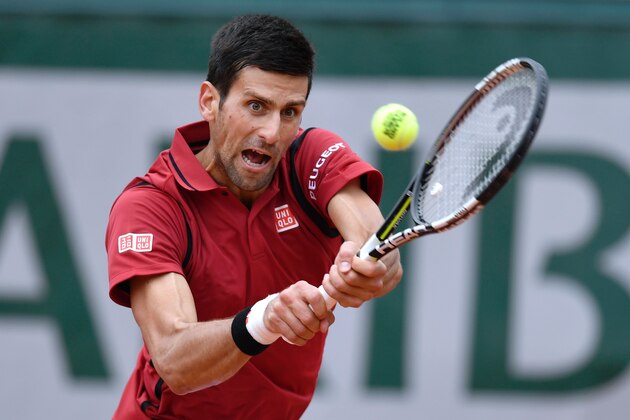 Serbia's Novak Djokovic returns the ball to Spain's Roberto Bautista-Agut during their men's fourth round match at the Roland Garros 2016 French Tennis Open in Paris on June 1, 2016. / AFP / PHILIPPE LOPEZ        (Photo credit should read PHILIPPE LOPEZ/AFP/Getty Images)