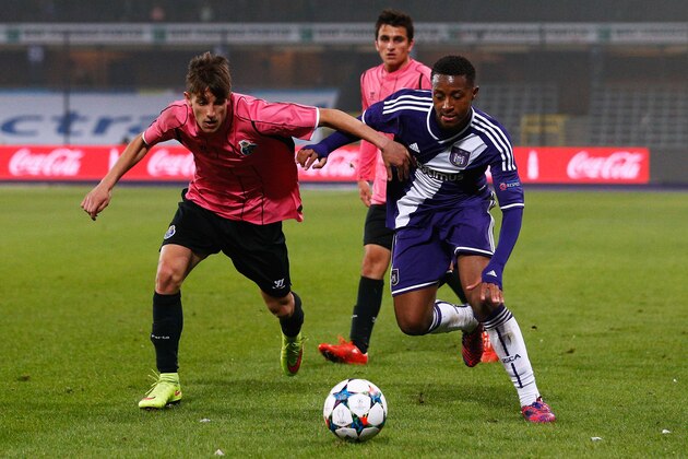 BRUSSELS, BELGIUM - MARCH 18:  Samuel Bastien of Anderlecht and Fernando of Porto battle for the ball during the UEFA Youth League quarter final match between RSC Anderlecht and FC Porto at Constant Vanden Stock Stadium on March 18, 2015 in Brussels, Belgium.  (Photo by Dean Mouhtaropoulos/Getty Images for UEFA)