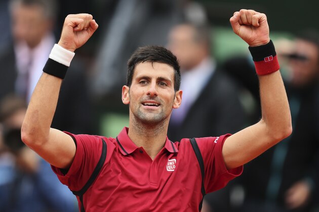 Serbia's Novak Djokovic celebrates winning his fourth round match of the French Open tennis tournament against Spain’s Roberto Bautista Agut at the Roland Garros stadium in Paris, France, Wednesday, June 1, 2016. (AP Photo/David Vincent)