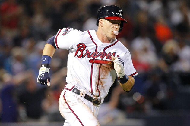Atlanta Braves second baseman Gordon Beckham (7) rounds first in the seventh inning of a baseball game against the Philadelphia Phillies, Thursday, May 12, 2016, in Atlanta. (AP Photo/Brett Davis)