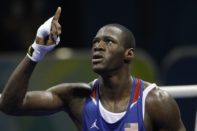 USA's Deontay Wilder reacts after defeating Abdelaziz Touilbini of Algeria in a men's heavyweight 91-kilogram preliminary boxing match at the Beijing 2008 Olympics in Beijing, Wednesday, Aug. 13, 2008. (AP Photo/Rick Bowmer)