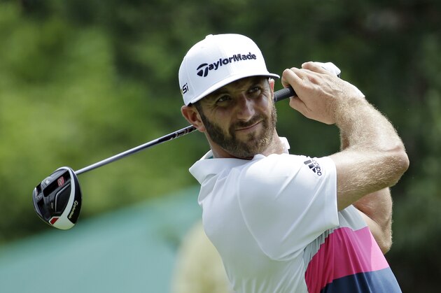 Dustin Johnson watches his tee shot on the 15th hole during the first round of the Memorial golf tournament, Thursday, June 2, 2016, in Dublin, Ohio. (AP Photo/Darron Cummings)