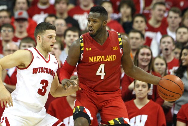 Jan 9, 2016; Madison, WI, USA; Maryland Terrapins forward Robert Carter (4) works the ball against Wisconsin Badgers guard Zak Showalter (3) at the Kohl Center. Maryland defeated Wisconsin 63-60. Mandatory Credit: Mary Langenfeld-USA TODAY Sports