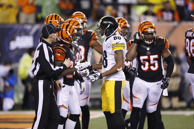 CINCINNATI, OH - JANUARY 9: Darrius Heyward-Bey #88 of the Pittsburgh Steelers exchanges words with Adam Jones #24 of the Cincinnati Bengals during the AFC Wild Card Playoff game at Paul Brown Stadium on January 9, 2016 in Cincinnati, Ohio. The Steelers defeated the Bengals 18-16. (Photo by Joe Robbins/Getty Images)