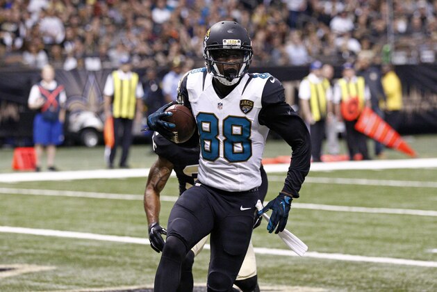 Jacksonville Jaguars wide receiver Allen Hurns (88) pulls in a touchdown reception in front of New Orleans Saints defensive back Chris Owens (30) in the second half of an NFL football game in New Orleans, Sunday, Dec. 27, 2015. (AP Photo/Rogelio Solis)
