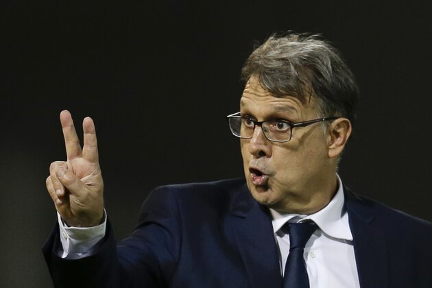 FILE - In this March 29, 2016, file photo, Argentina's coach Gerardo Martino gives instructions to his players during a 2018 World Cup qualifying soccer match against Bolivia in Cordoba, Argentina.(AP Photo/Natacha Pisarenko, File)
