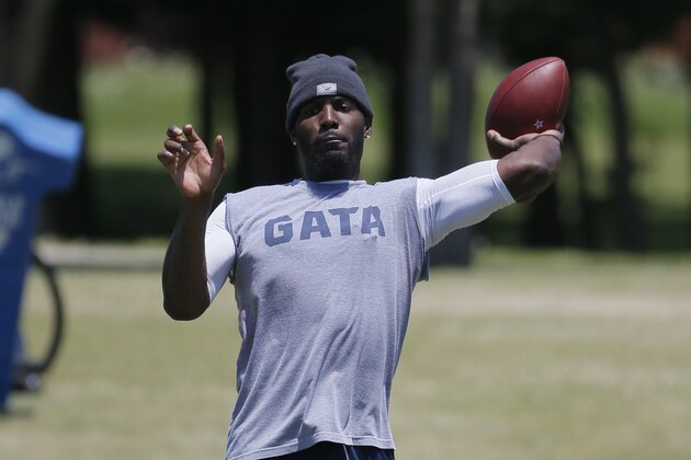 FILE - In this May 7, 2016, file phoito, Dallas Cowboys wide receiver Dez Bryant tosses the ball as he watches rookies work out during the team's NFL football minicamp in Irving, Texas. Quarterback Tony Romo is practicing for the first time since before last year's Thanksgiving loss to Carolina, when he broke his left collarbone for the second time in 2015. (AP Photo/Tony Gutierrez, File)