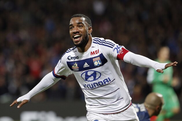 Lyon's Alexandre Lacazette celebrates after he scored his third goal against Saint-Etienne during their French League One soccer match at Gerland stadium, in Lyon, central France, Sunday, Nov. 8, 2015. (AP Photo/Laurent Cipriani)