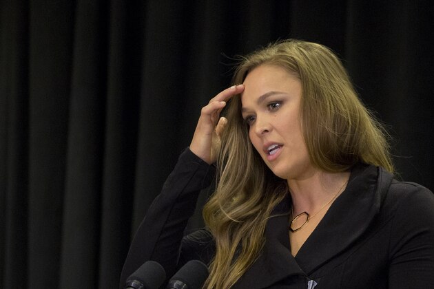 UFC fighter Ronda Rousey speaks at a ceremony in New York before Gov. Andrew Cuomo signed into law a bill that will allow professional mixed martial arts, Thursday, April 14, 2016. New York was the last U.S. state to prohibit the bouts. (AP Photo/Mark Lennihan)