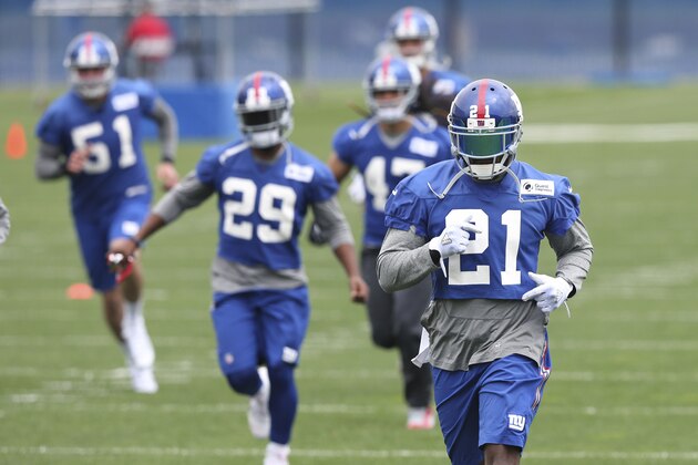 New York Giants safety Landon Collins (21) and others run drills during an NFL football minicamp Wednesday, April 27, 2016, in East Rutherford, N.J. (AP Photo/Mel Evans)