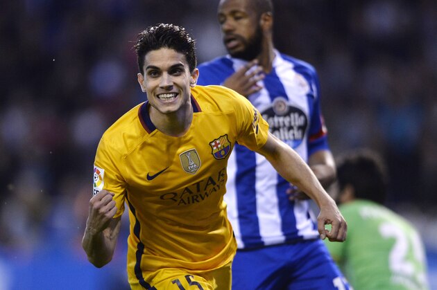 Barcelona's defender Marc Bartra celebrates after scoring a goal during the Spanish league football match RC Deportivo de la Coruna vs FC Barcelona at the Municipal de Riazor stadium in La Coruna on April 20, 2016. / AFP / MIGUEL RIOPA        (Photo credit should read MIGUEL RIOPA/AFP/Getty Images)