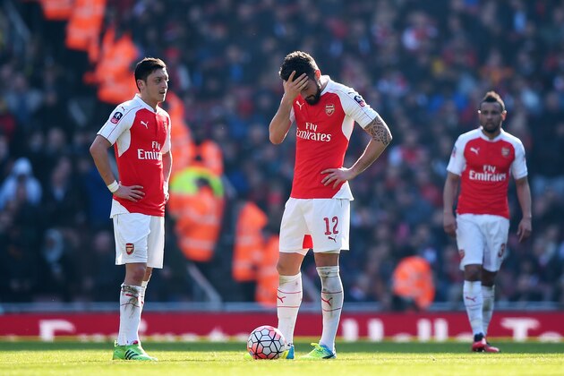 LONDON, ENGLAND - MARCH 13:  Olivier Giroud (12) and Mesut Ozil (11) of Arsenal look dejected as Adlene Guedioura of Watford scores their second goal during the Emirates FA Cup sixth round match between Arsenal and Watford at Emirates Stadium on March 13, 2016 in London, England.  (Photo by Shaun Botterill/Getty Images)
