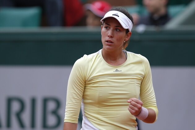 Spain's Garbine Muguruza clenches her fist as she plays Australia's Samantha Stosur during their semifinal match of the French Open tennis tournament at the Roland Garros stadium, Friday, June 3, 2016 in Paris.  (AP Photo/Michel Euler)