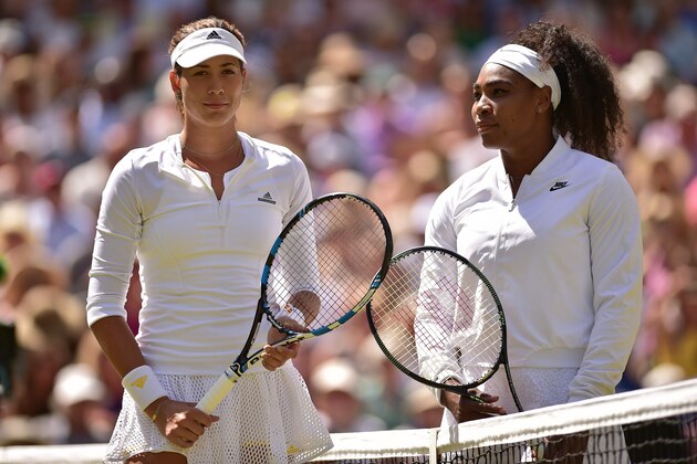 Spain's Garbine Muguruza (L) and US player Serena Williams (R) pose at the net before the start of the women's singles final on day twelve of the 2015 Wimbledon Championships at The All England Tennis Club in Wimbledon, southwest London, on July 11, 2015.   RESTRICTED TO EDITORIAL USE  --  AFP PHOTO / LEON NEAL        (Photo credit should read LEON NEAL/AFP/Getty Images)