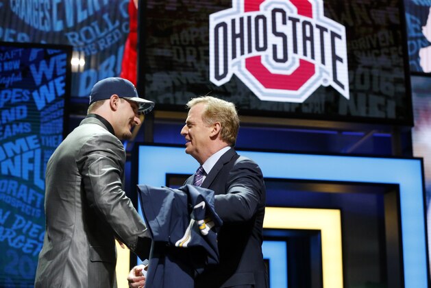Ohio State’s Joey Bosa shakes hands with NFL commissioner Roger Goodell after being selected by the San Diego Chargers as the third pick in the first round of the 2016 NFL football draft, Thursday, April 28, 2016, in Chicago. (AP Photo/Charles Rex Arbogast)