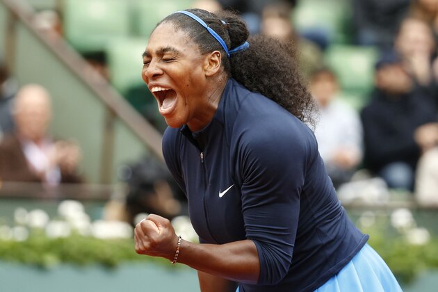 Serena Williams of the U.S. clenches her fist after scoring a point in the semifinal match of the French Open tennis tournament against Netherlands' Kiki Bertens at the Roland Garros stadium in Paris, France, Friday, June 3, 2016. (AP Photo/Alastair Grant)