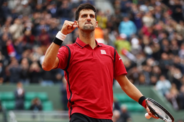 PARIS, FRANCE - JUNE 03:  Novak Djokovic of Serbia celebrates victory during the Men's Singles semi final match against Dominic Thiem of Austria on day thirteen of the 2016 French Open at Roland Garros on June 3, 2016 in Paris, France.  (Photo by Clive Brunskill/Getty Images)