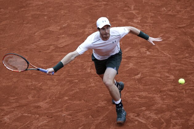 Britain's Andy Murray returns the ball to Switzerland's Stan Wawrinka during their semifinal match of the French Open tennis tournament at the Roland Garros stadium, Friday, June 3, 2016 in Paris. (AP Photo/Christophe Ena)