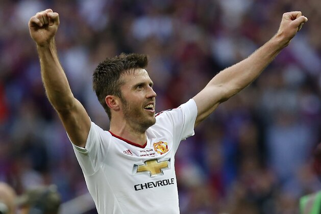 Manchester United's Michael Carrick celebrates after his team won during the English FA Cup final football match between Crystal Palace and Manchester United at Wembley stadium in London on May 21, 2016. / AFP / Ian Kington / NOT FOR MARKETING OR ADVERTISING USE / RESTRICTED TO EDITORIAL USE        (Photo credit should read IAN KINGTON/AFP/Getty Images)