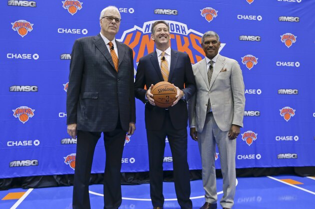 New York Knicks general manger Steve Mills, right, Jeff Hornacek, center, and president Phil Jackson, left, pose for photographs during a news conference to announce the hiring of Hornacek as the team's head coach Friday, June 3, 2016, in Tarrytown, N.Y. (AP Photo/Frank Franklin II)